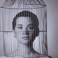 As Hedda Gabler with Bird cage on head